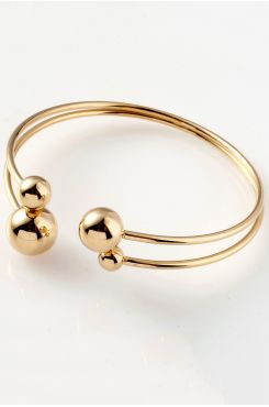 GOLD CUFF BRACELET WITH OPENING ON THE TOP AND DECORATIVE BALLS  | BRACELETS